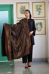 Woman draped in bronze paisley shawl for wedding occasion