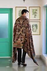 Jewel tone shawl folded to showcase intricate paisley pattern