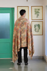 Close-up of deep red jacquard weave on his shawl