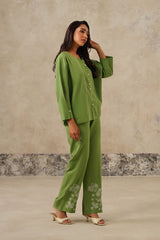 Side view of green linen shirt with sweetheart neckline