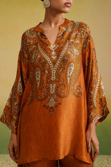 Detail of rust cream paisley printed coord top