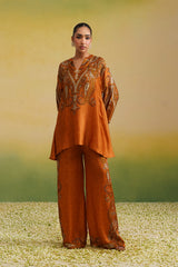 Front view of rust paisley printed high-low kurta with side slits