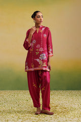 Woman wearing pink floral printed tissue co-ord set with striped salwar full view, festive coord