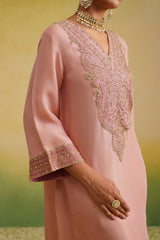 side view of zardozi embroidery on onion pink patch and blush pink tissue kaftan dress