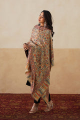 Woman wearing beige Kani shawl, a luxury bridal gift