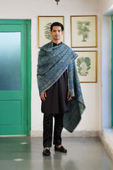 Teal mandala wool shawl folded to show floral design