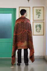 Floral paisley shawl draped over shoulder for festive celebration