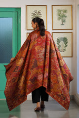 Deep red shawl folded to show jacquard weave pattern