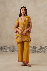 Woman wearing yellow floral printed co-ord set 