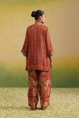 back view of  rust printed farshi salwar set with embroidered neckline and dupatta