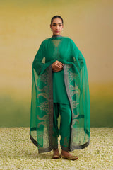 Woman wearing emerald green hand embroidered co-ord set with sheer dupatta