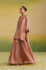 side view of pink tissue sharara set
