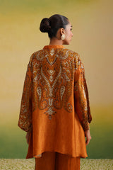Back view of asymmetric high-low hem on rust paisley printed coord