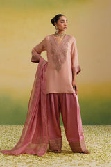 Woman wearing pink silk farshi salwar set with hand embroidered kurta and dupatta