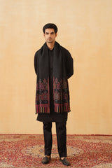 Close-up of black wool shawl motif weave, festive gifting essential