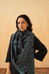 Woman draped in navy blue Jamawar wool shawl for wedding