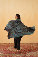 Woman styled in navy Jamawar shawl for festive celebration
