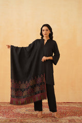 Woman draped in black classic motif wool shawl for wedding gifting