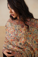 Woman draped in beige Kani pashmina shawl for luxury wedding